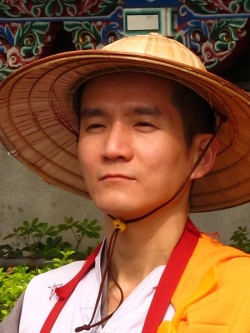 Taiwanese Buddhist Monk Bamboo Hat Close.jpeg