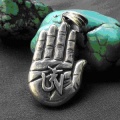 Palm carved with Tibetan mantra.jpg