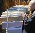 Buddhist-priests-and-coffins-of-tsunami-victims.jpg